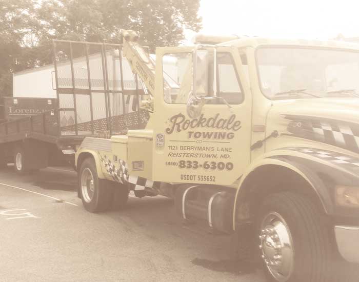 Rockdale-Towing-&-Roadside-Assistance-About-Page-SliderTow-Truck-hooked-to-trailer
